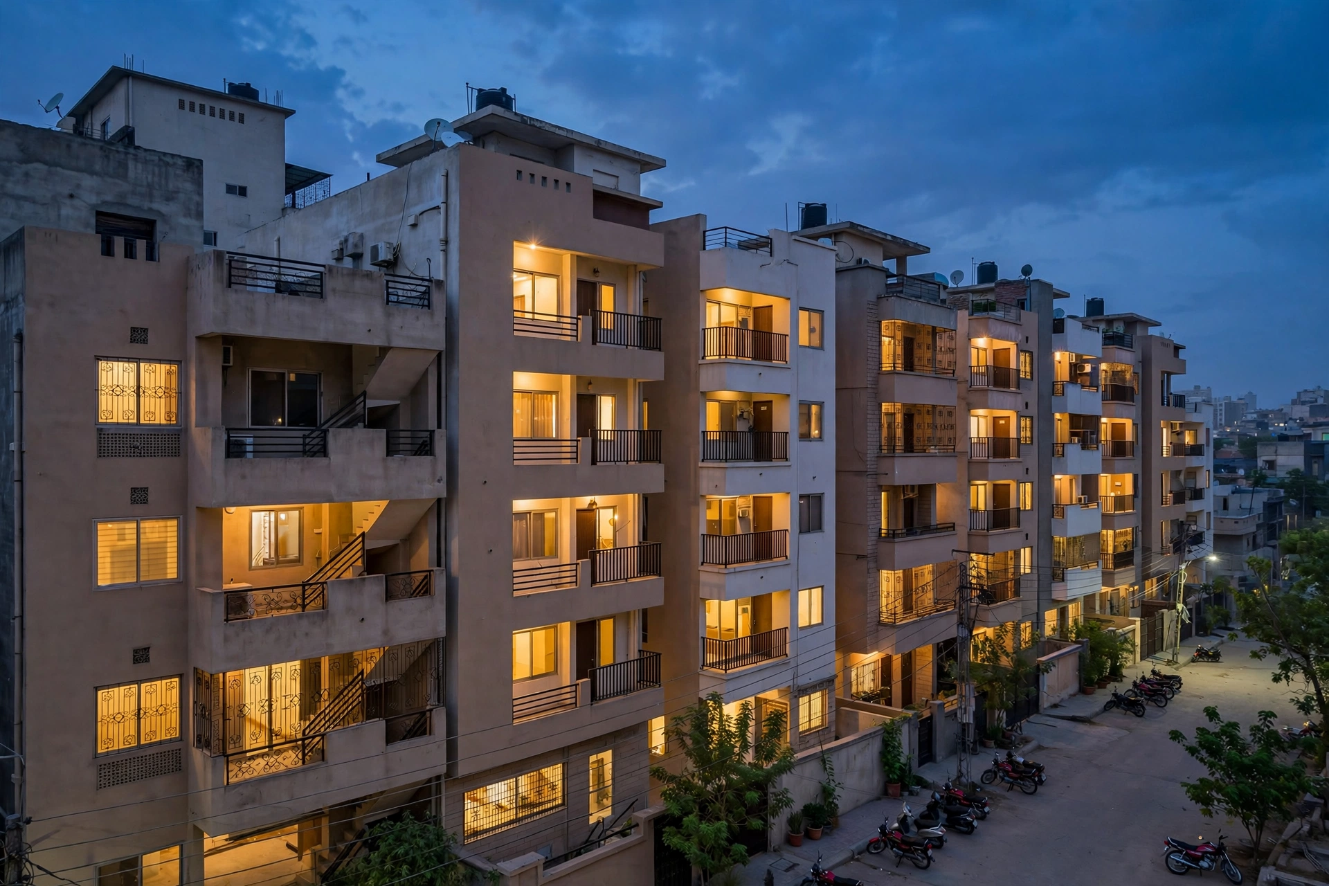Apartment buildings at dusk with lit windows